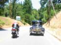 Model A Ford Doing The Twisties With A Sport Bike