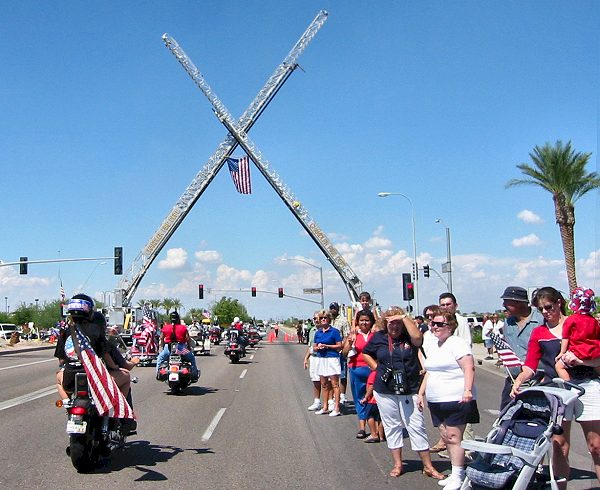 Ladder Trucks Display The Flag