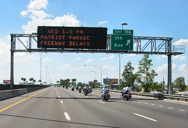 The Freeway Sign Announces The Patriot Parade