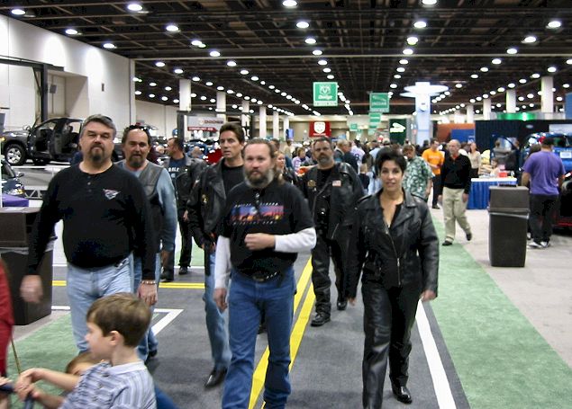 Riders Walking The Autoshow Roadway
